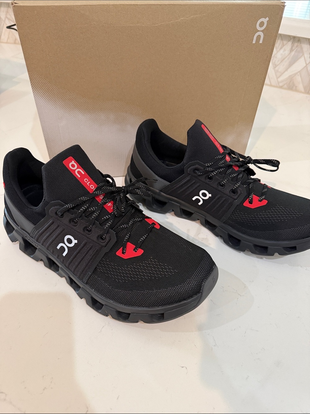 On Cloudventure Men’s Black and Red Trail Sneakers